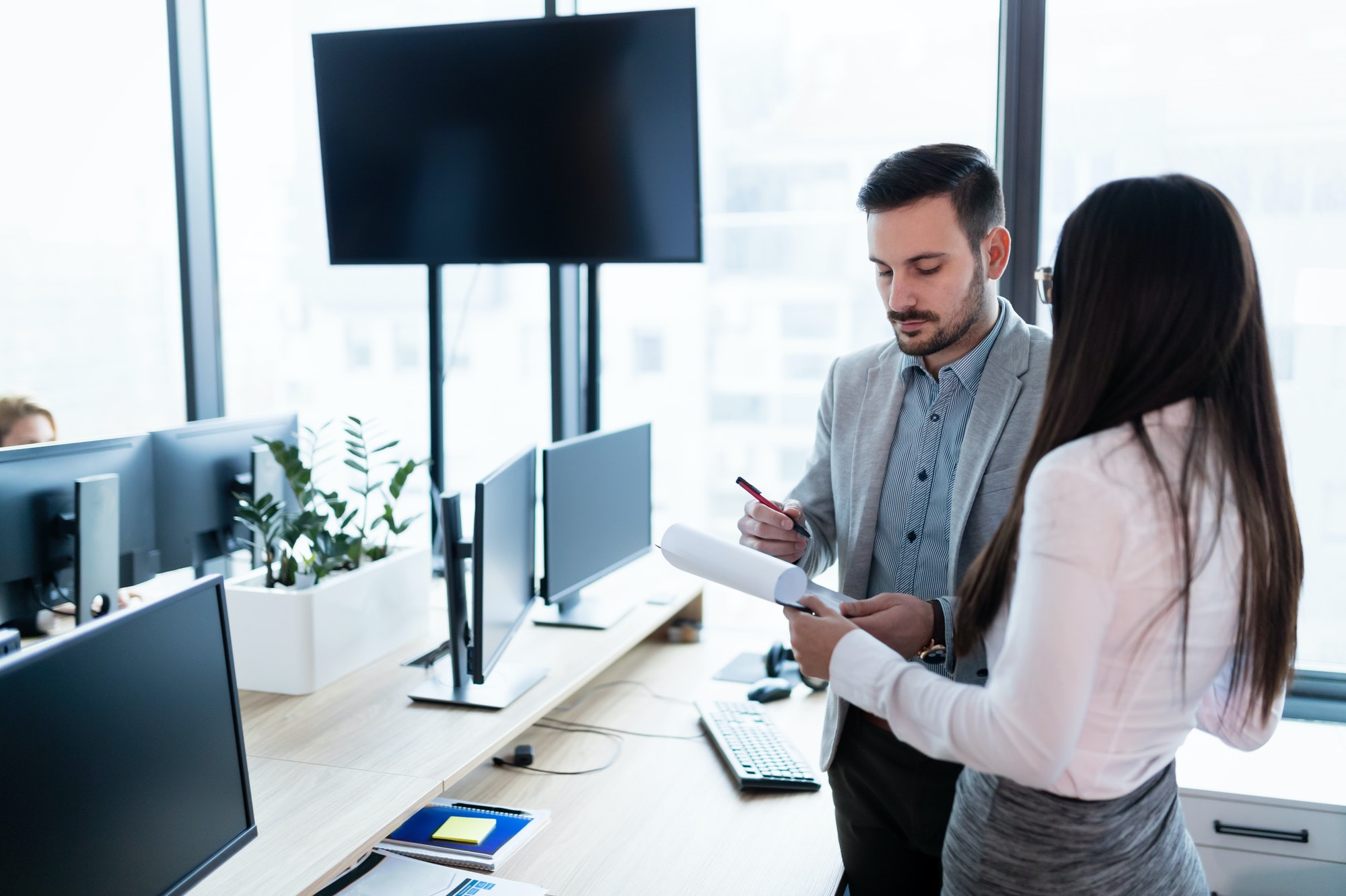 Portrait of business partners talking about finances