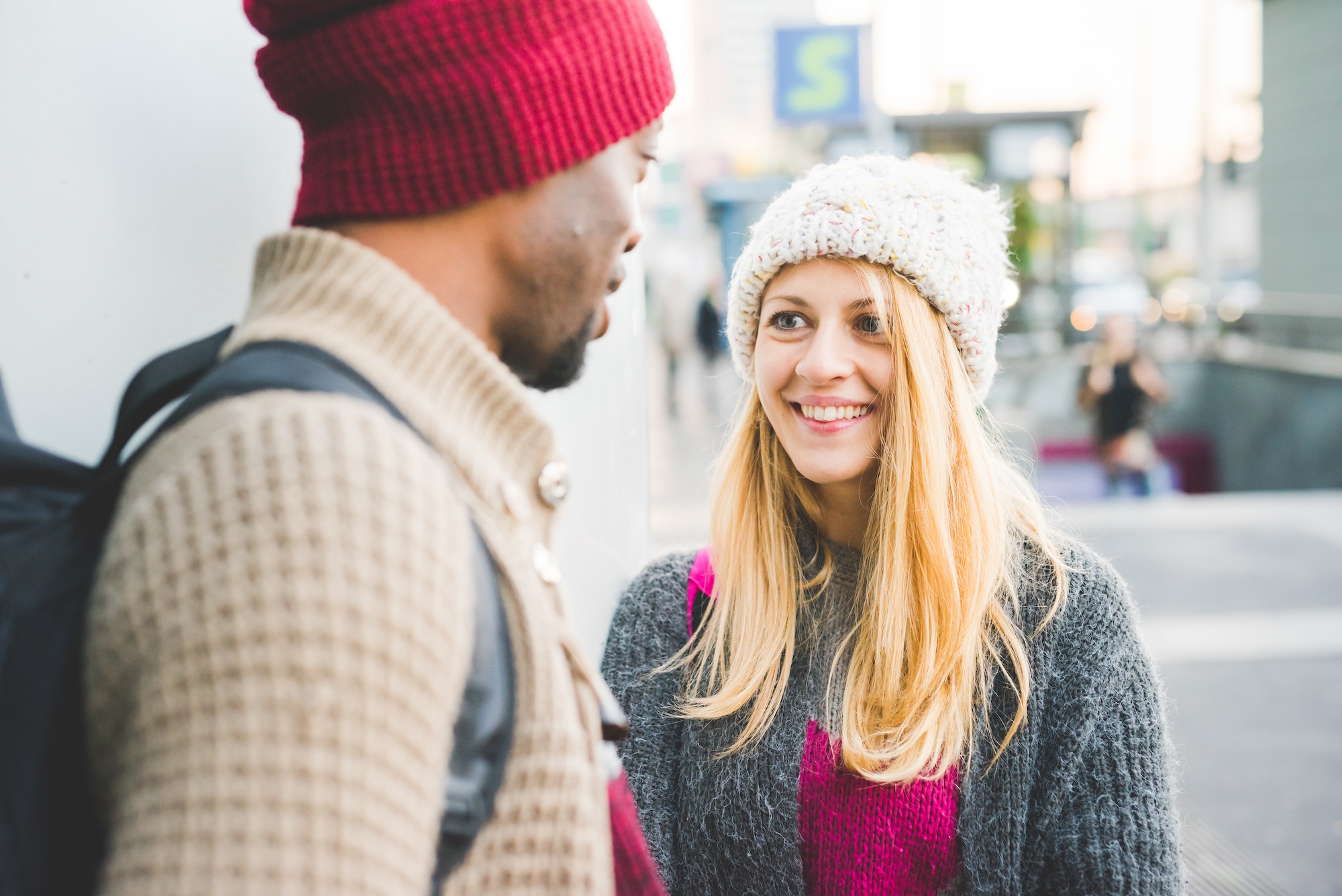Couple chatting in city