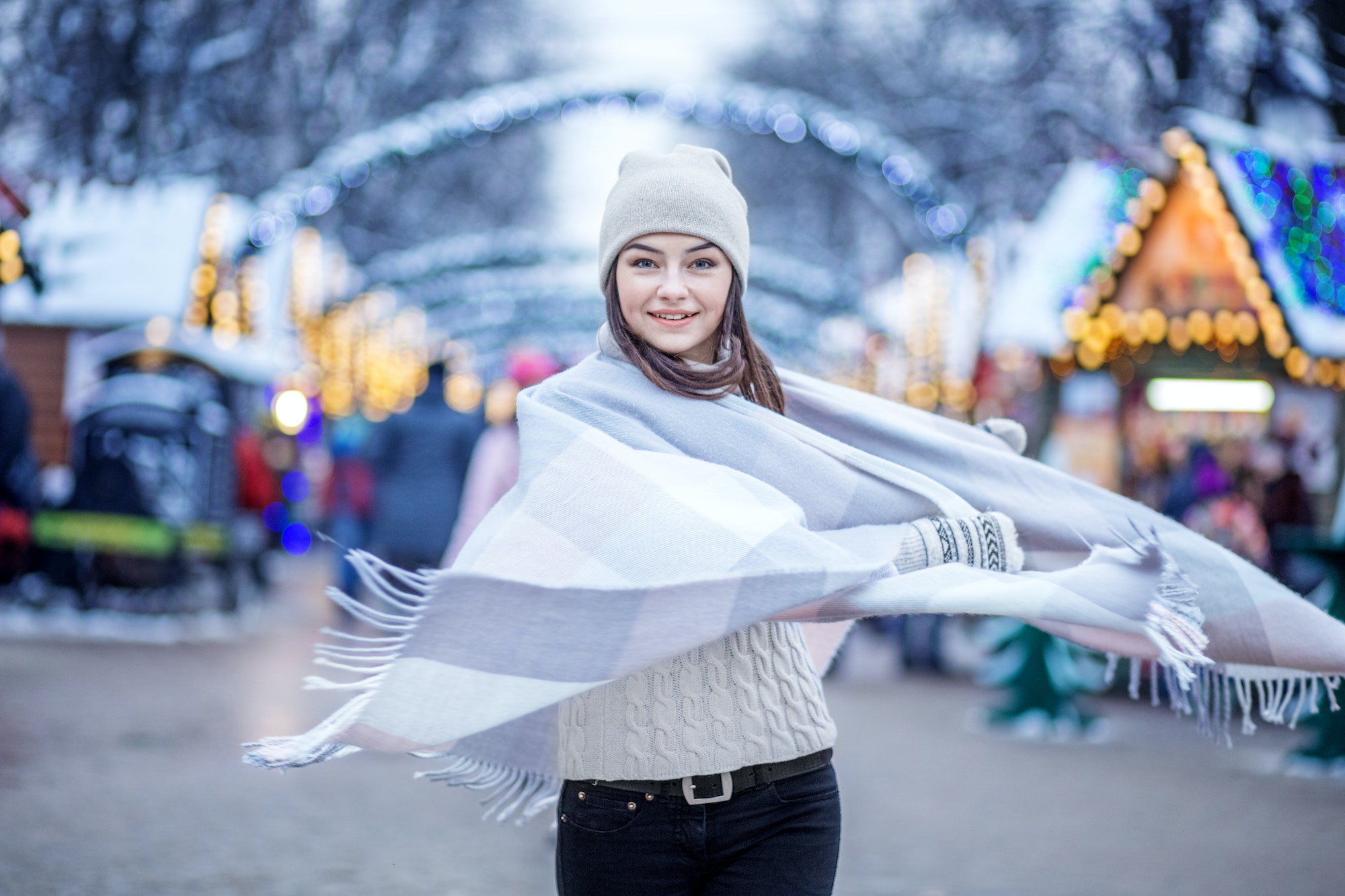 Happy young woman wearing a hat and a scarf. Concept Lifestyle, Urban, Winter, Vacation